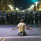 Phoenix police use gas on a protester outside the Phoenix Convention Center on Tuesday. President Trump held a rally in Phoenix earlier in the evening in which he launched “vicious attacks” on the news media. (Michael Chow/Arizona Republic/azcentral.com)